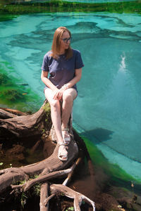 Portrait of woman sitting in water
