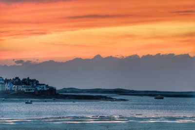 Scenic view of sea against romantic sky