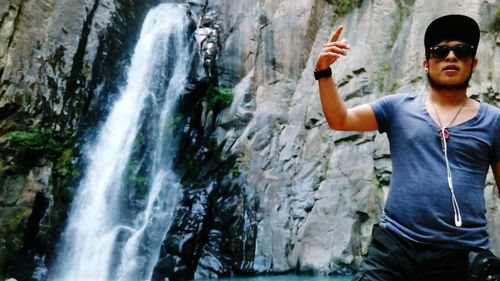 View of waterfall with rocks in background