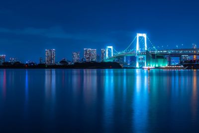 Illuminated city at waterfront