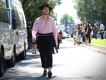 Full length of man walking on road