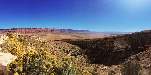 View of landscape against clear blue sky