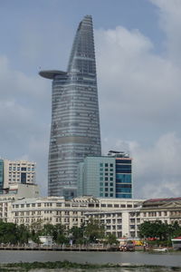 Skyscrapers against cloudy sky