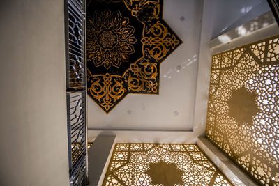 Low angle view of illuminated staircase in building