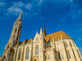 Low angle view of historical building against blue sky