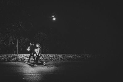 People on street at night