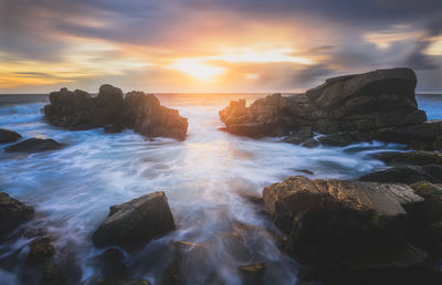 Scenic view of sea against sky during sunset