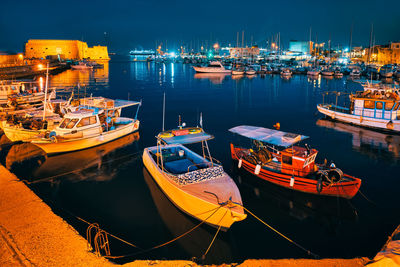 Venetian fort in heraklion and moored fishing boats, crete island, greece