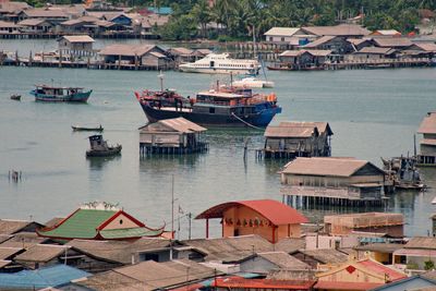 High angle view of boats moored at harbor