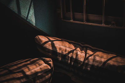 Low section of shoes on bed