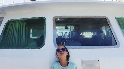 Close-up of girl leaning on boat