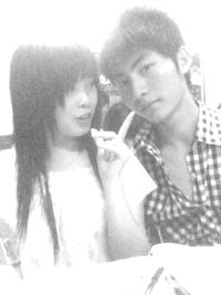 Young woman holding smart phone