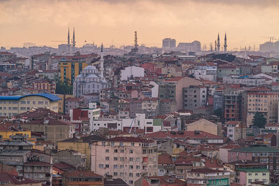 View of town against cloudy sky