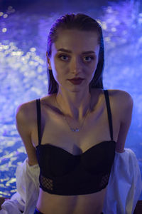 Portrait of young woman in swimming pool