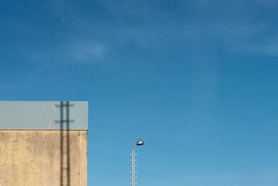 Low angle view of street light against sky