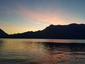 Scenic view of lake against sky during sunset