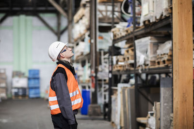 Technician male working in a store watching