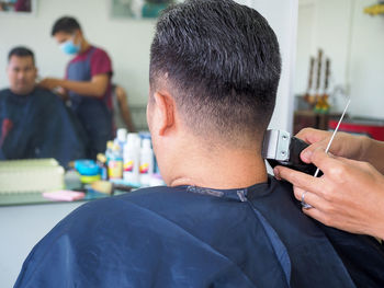 Hairdresser hairstyling male customer