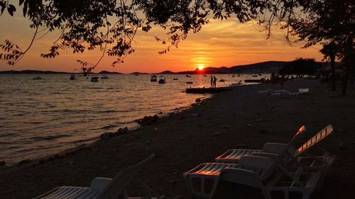 Scenic view of beach against sky during sunset