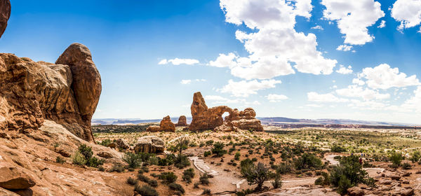 Rock formations on landscape against sky