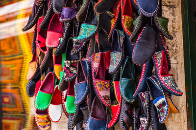 Multi colored umbrellas hanging at market stall