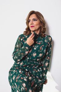 Portrait of a serious young woman over white background