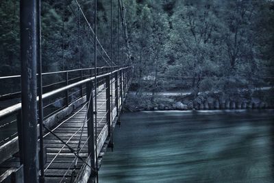 Bridge over river in forest