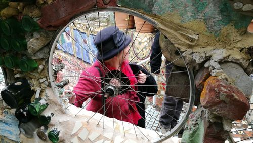 High angle view of woman standing by wall