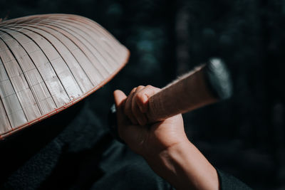 Close-up of man holding sword