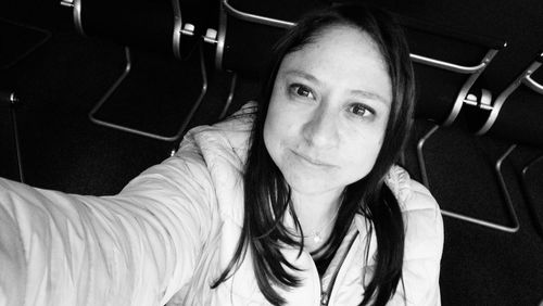 High angle portrait of young woman in movie theater