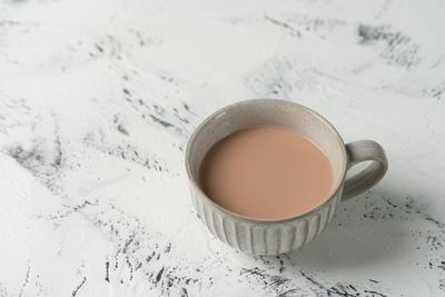 High angle view of coffee cup on table