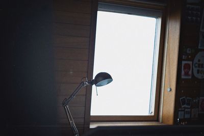 Low angle view of street light against wall