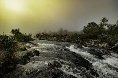 Scenic view of river against sky