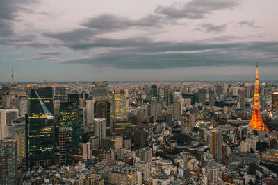 Aerial view of modern buildings in city against sky