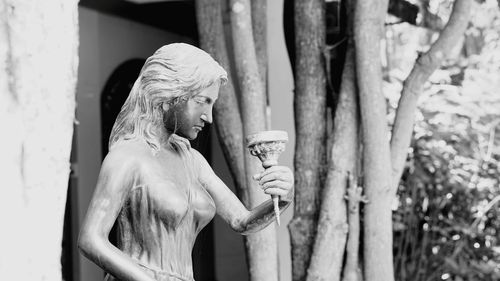 Side view of woman drinking water