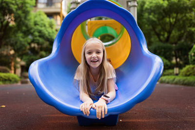 Portrait of smiling girl in playground