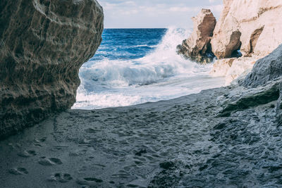 Waves splashing on rocks at beach