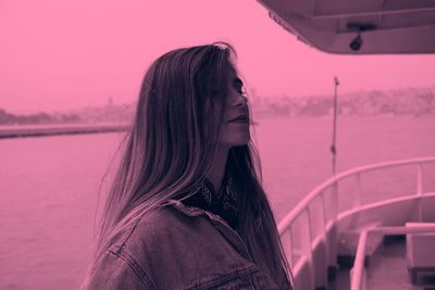 Portrait of woman standing against sky during sunset
