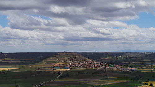 Scenic view of landscape against cloudy sky