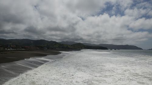 Scenic view of beach against sky