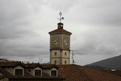 Low angle view of built structure against cloudy sky