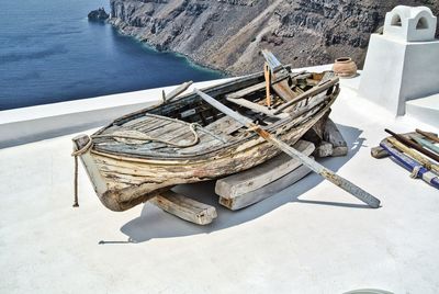 High angle view of abandoned boat moored on beach