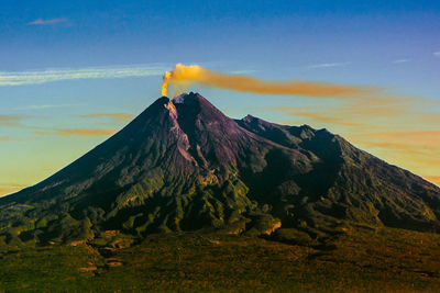 Scenic view of volcanic mountain against sky