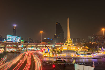 Light trails on city buildings at night