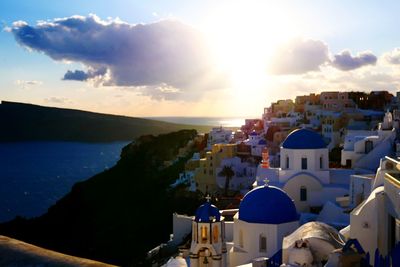 High angle view of townscape by sea against sky