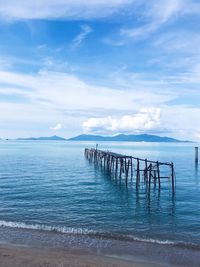 Pier on sea against sky