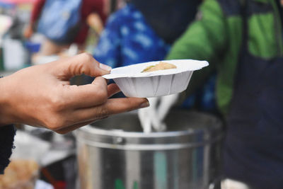 Close-up of hand holding panipuri