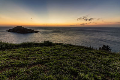 Scenic view of sea against sky during sunset