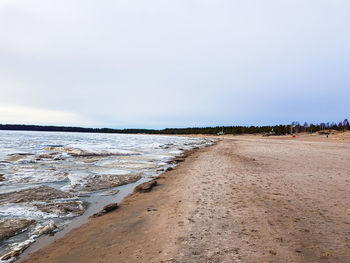 Scenic view of beach against clear sky