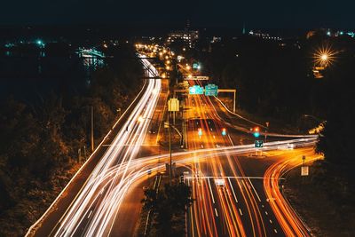 High angle view of light trails on road at night